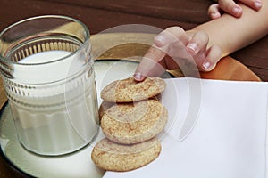 Young Child taking a Snickerdoodle cookie