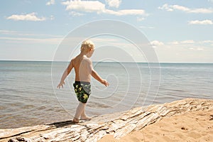 Young Child Walking on Beach