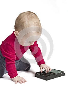 Young child in white background with hard drive
