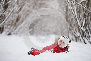 Young child in the winter park.