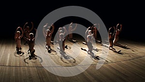 Young children dancing ballet on a stage. Ballet.