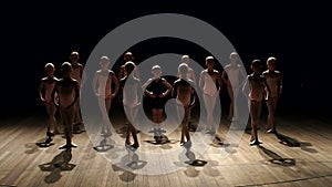 Young children engaged in ballet at ballet school.