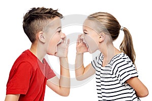 Young children facing eachother and shouting. Speech therapy concept over white background.