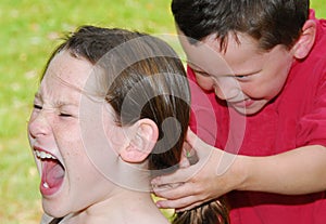 Young children fighting photo