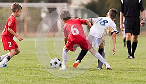 Young children players football match on soccer field