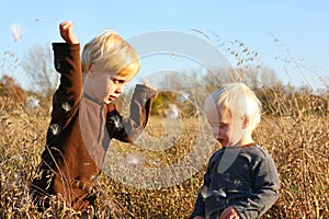 Young Children Playing Outside in Autumn