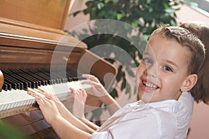 Young Children Playing the Piano