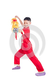 Young chinese boy playing chinese lion puppet