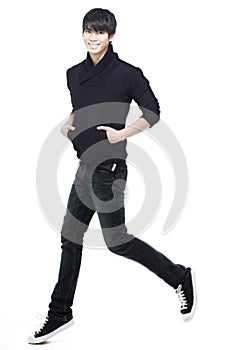 Young Chinese man running, jogging and jumpi