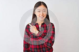 Young chinese woman wearing casual jacket standing over isolated white background cheerful with a smile on face pointing with hand