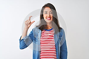 Young chinese woman wearing striped t-shirt and denim shirt over isolated white background smiling and confident gesturing with