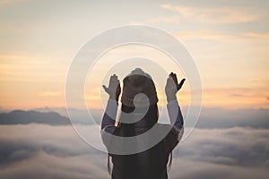 Young christian woman hands open palm up worship and praying to