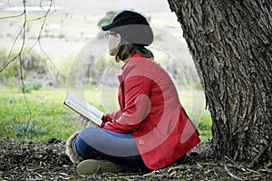 Young Christian woman meditating Gods word in praise and worship