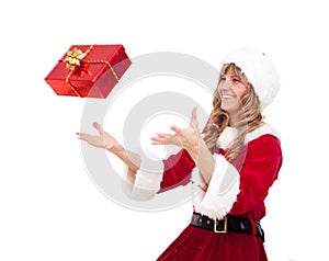 Young Christmas Woman is catching an xmas present