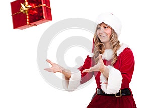 Young Christmas Woman is catching an xmas present