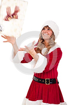 Young Christmas Woman is catching an xmas present