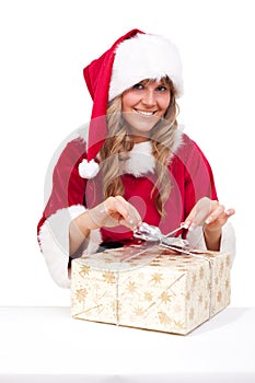 Young Christmas Woman is opening an xmas present