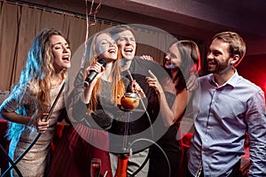 Young clubbers spend time in karaoke bar