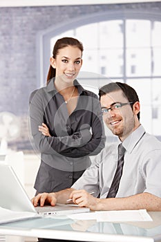 Young colleagues working smiling in bright office