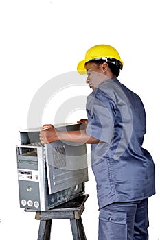 Young computer maintenance technician opens a desktop computer.