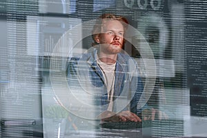 Young concentrated computer developer writing new code