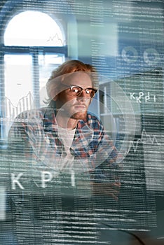 Young concentrated computer developer writing new code