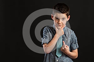 Young Confident Boy with Hand On Chin