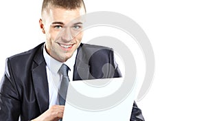 Young confident business man with laptop