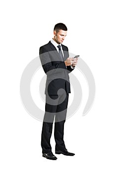 Young and confident business man with a telephone