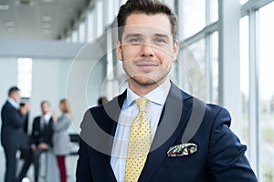 Young and confident businessman. Handsome young man in formalwear smiling at camera