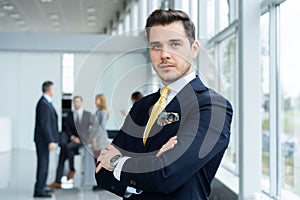 Young and confident businessman. Handsome young man in formalwear smiling at camera