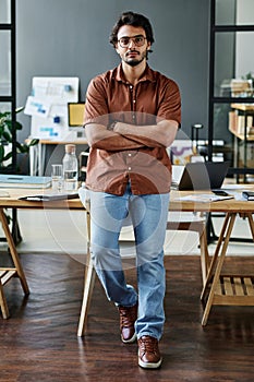 Young confident businessman in smart casualwear and eyeglasses