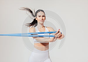 Young and confident female athlete warming up her hands