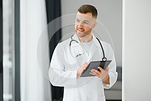 Young and confident male doctor portrait. Successful doctor career concept.