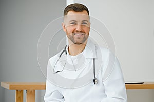 Young and confident male doctor portrait. Successful doctor career concept.