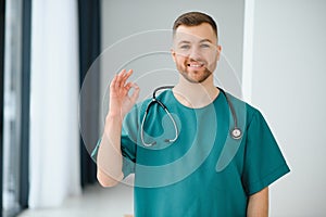 Young and confident male doctor portrait. Successful doctor career concept.