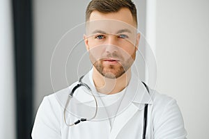 Young and confident male doctor portrait. Successful doctor career concept.