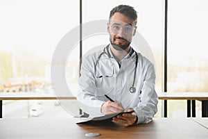 Young and confident male doctor portrait. Successful doctor career concept