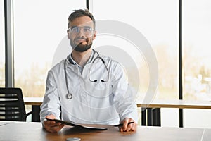 Young and confident male doctor portrait. Successful doctor career concept
