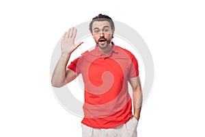 young confused man with black hair and beard dressed in a red t-shirt with an identity mockup on a white background with