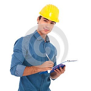 Young construction egineering student taking notes