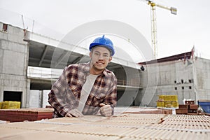 Young Construction Worker At Building Site
