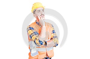 Young construction worker or engineer thinking and looking away