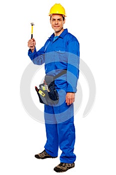 Young construction worker holding hammer