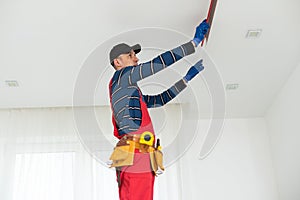 young construction worker. the man works on repairs