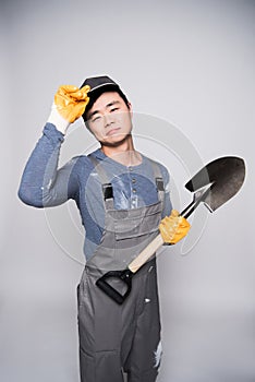 Construction worker holding shovel