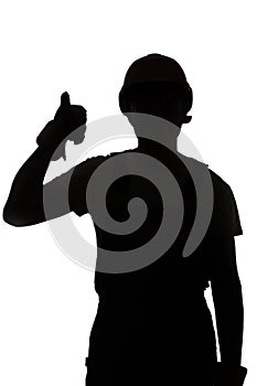 Young construction worker silhouette in hard hat showing thumbs up class sign on white isolated background