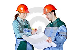 Young construction workers with blueprint