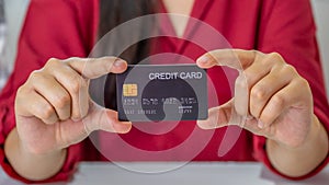 Young consumer woman holding mock up credit card, Ready to spending pay online shopping according to discount products via