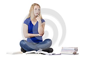 Young, contemplative female student with books